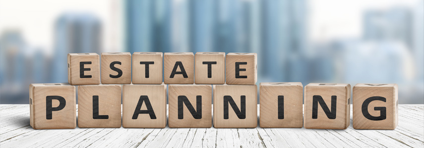 The word estate planning spelled out in wooden blocks.