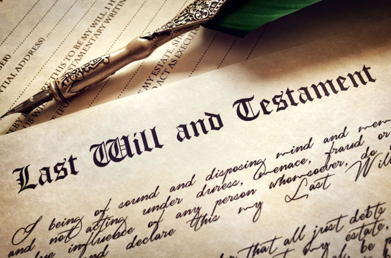 A document with the words last will and testament on it.